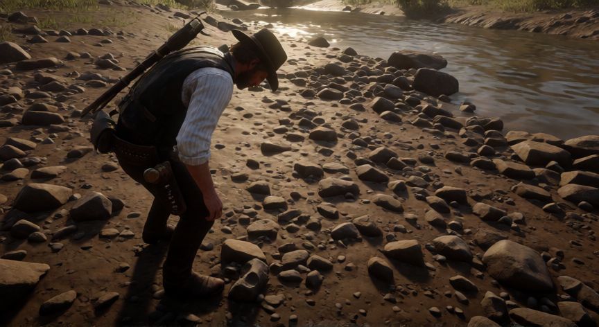 como encontrar huesos de dinosaurios red dead redemption 2, Personaje buscando huesos de dinosaurio a pie en una ribera seca