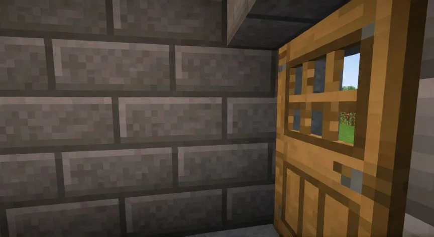 Vista del catalejo en Minecraft mostrando zoom con viñeta negra sobre un paisaje