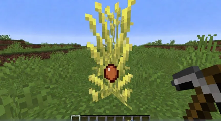 Parcela de trigo Minecraft en fase temprana con agua central y vallas de madera