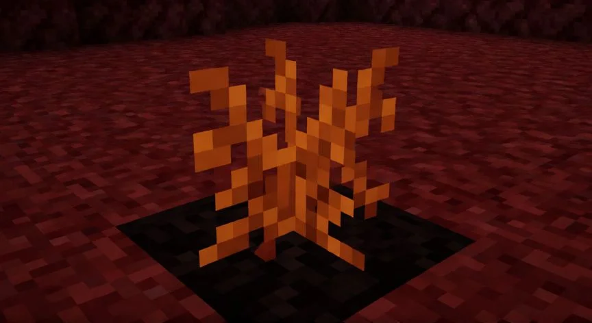 Planta de verruga del nether creciendo sobre un azulejo de basalto en Minecraft