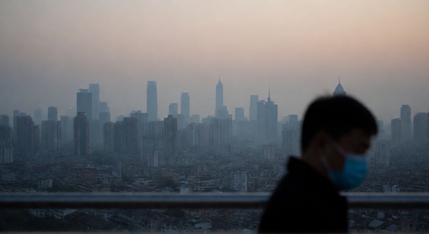 covid 19 wikipedia english, Wuhan city skyline at dusk with a masked figure, symbolizing the start of the pandemic