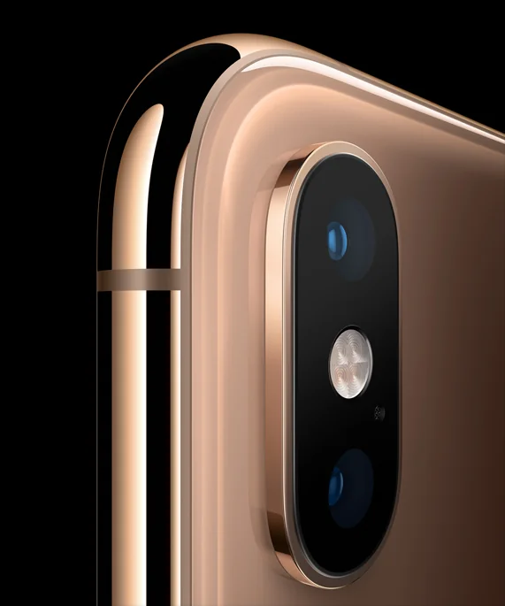 que iphone ocupa esim, Primer plano detallado del módulo de cámara dual del iPhone XS Max en color oro con acabado pulido