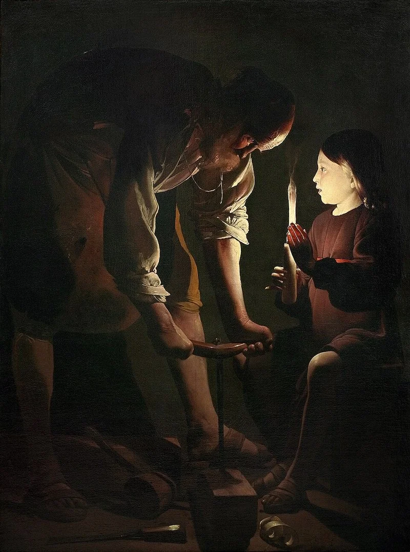 San José carpintero, óleo de Georges de La Tour (década de 1640, Museo del Louvre): José, inclinado sobre su banco de trabajo con el serrucho, ilumina el taller